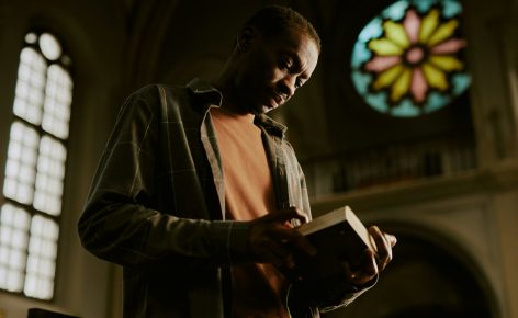 Black Man Reading Bible In Church